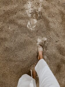feet walking in sand